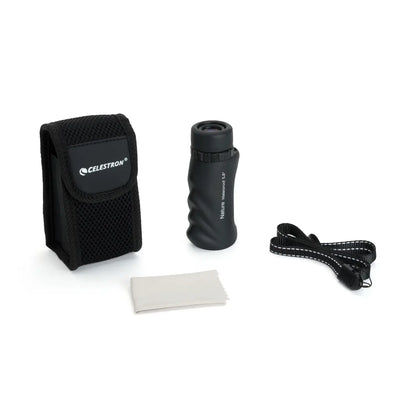 Celestron monocular with carrying case, lens cleaning cloth, and strap on a white background