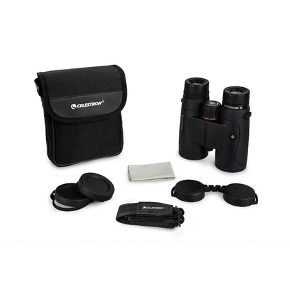 Celestron binoculars with carrying case and accessories on a white background