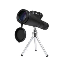 Black monocular with a silver tripod on a white background