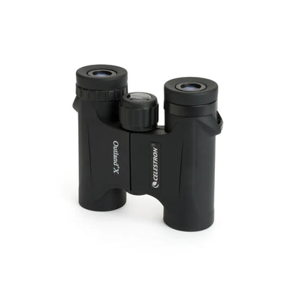 Black Celestron binoculars on a white background