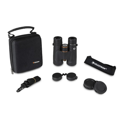 Celestron binoculars with carrying case and accessories on a white background