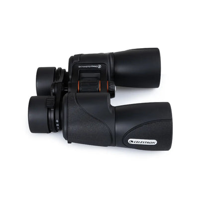 Black Celestron binoculars on a white background