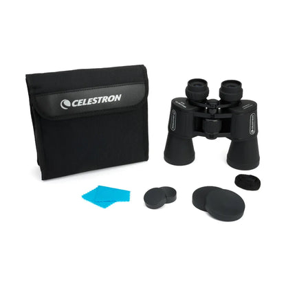 Celestron binoculars with cleaning cloth and lens caps on a white background