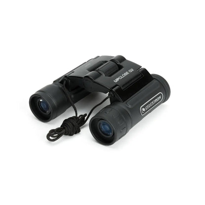 Black Celestron binoculars on a white background