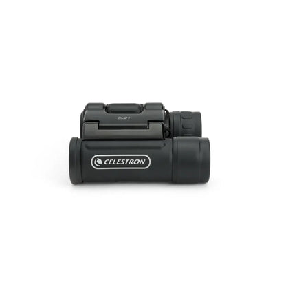 Black Celestron binoculars on a white background