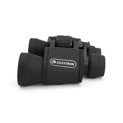 Black Celestron binoculars on a white background