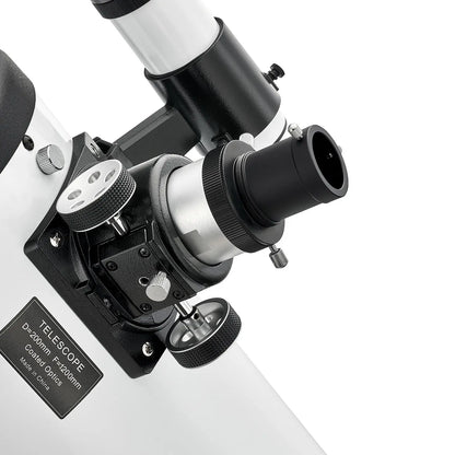 Close-up of a telescope with a white background