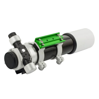 Telescope with a green eyepiece on a white background