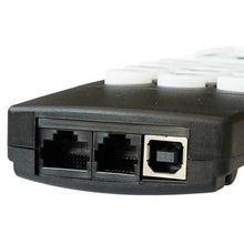 Close-up of a black electronic device with multiple ports on a white background